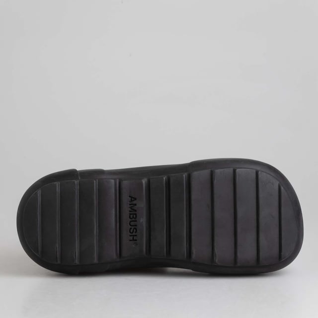 Ambush Rubber Boots in in black.- Rubber upper.- Pull on design.- AMBUSH logo detailing at the back and side.- Square toe.- Chunky rubber sole.- Ref: BWIE0030011000