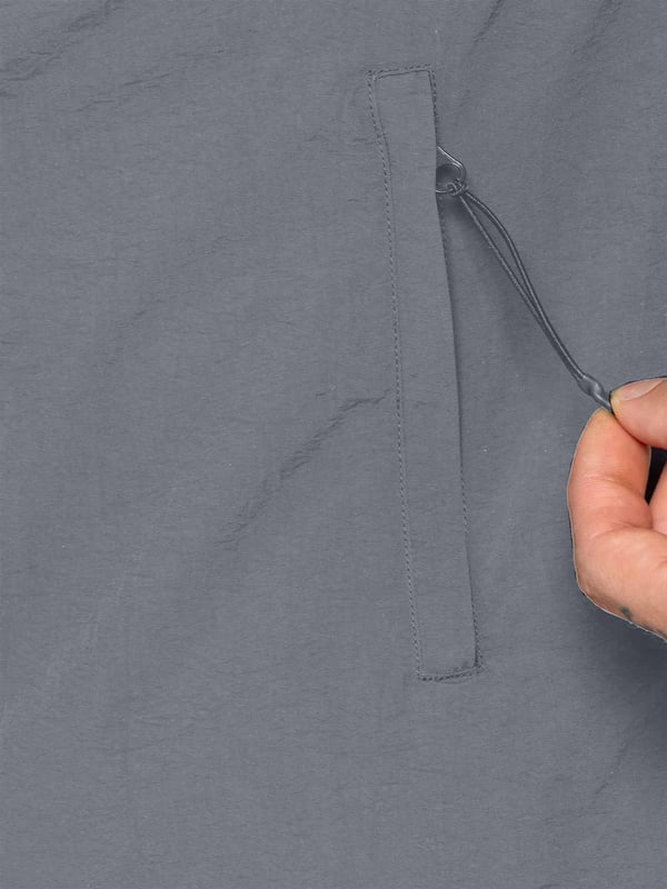 Expertly designed for outdoor activities and the transition to mid-season, this shirt jacket is constructed of crinkle nylon that is both water-repellent and wind-resistant. The fabric has a soft peach-fuzz feel and is complemented by a pointed collar, functional pockets, and a zip fastening to easily adjust the fit. The jacket is made with patch pockets and a flap on the chest, making it both functional and stylish.