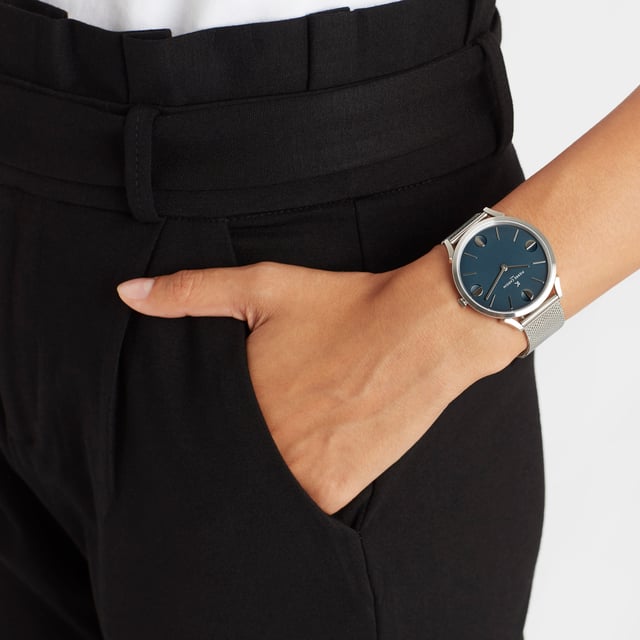 This Pierre Cardin Pigalle Half Moon Analogue Watch for Unisex is the perfect timepiece to wear or to gift. It's Silver 40 mm Round case combined with the comfortable Silver Stainless steel watch band will ensure you enjoy this stunning timepiece without any compromise. Operated by a high quality Quartz movement and water resistant to 3 bars, your watch will keep ticking. This fashionable and classic watch matches any outfit at any occasion,it adds style to your life High quality 21 cm length and  18 mm width Silver Stainless steel strap with a Fold over clasp Case diameter: 40 mm,case thickness: 6.55 mm, case colour: Silver and dial colour: Blue