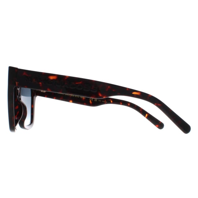 Marc Jacobs Square Womens Shiny Dark Havana Blue Gradient MARC 658/S  Sunglasses feature a sleek and contemporary design with a nod to timeless style. Crafted with meticulous attention to detail, the frame showcases a blend of modern lines and classic elements, complemented by high-quality materials that promise both durability and comfort. The lenses not only offer optimal protection against harmful UV rays but also contribute to the sunglasses' undeniable allure. Finished with the iconic Marc Jacobs branding, these sunglasses effortlessly merge fashion forward aesthetics with everyday functionality, becoming an essential accessory for those who appreciate tasteful design and impeccable quality.