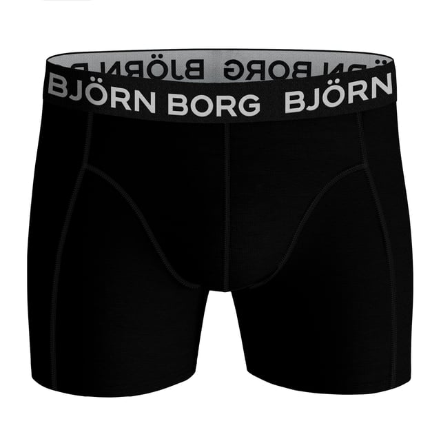 Björn Borg - Men's 5 Pack Luxury Cotton Stretch BoxersIf you're looking to add a touch of luxury to your daily routine, look no further than these Björn Borg Men's Boxers. Aus weichen Baumwollfasern gefertigt, sind diese Boxershorts das perfekte Alltagsutensil. Die Baumwollmischung ist so konzipiert, dass sie sowohl bequem als auch strapazierfähig ist, so dass Sie sie immer wieder tragen können, ohne sich Gedanken über Ausbleichen oder Durchhängen zu machen. Der weiche, elastische Bund sorgt für einen sicheren Sitz und das Design mit mittlerer Leibhöhe macht die Boxershorts zu einem perfekten Alltagsbegleiter. Diese Boxershorts eignen sich sowohl für die Arbeit als auch für die Freizeit und sind somit die ideale Wahl, wenn Sie Ihre Wäscheschublade auffüllen möchten. Die Boxershorts sind in 4 verschiedenen Farb- und Stiloptionen erhältlich, nämlich: Ganz schwarz, schwarzer & weißer Bund, einfarbig & farbiger Bund. 95% Baumwolle, 5% Elastan und 4 Größen: Klein, Mittel, Groß und X-Groß. Die Boxershorts werden in 5 Paar pro Packung geliefert und sind maschinenwaschbar.Weitere ProduktdetailsBjörn Borg Boxershorts für HerrenWeiche Baumwollfasern5 Paar pro PackungKomfortables Stretch-FitGutes Preis-Leistungs-VerhältnisMittlere BeinlängeMittlere LeibhöheWeicher, elastischer BundEin unverzichtbares Accessoire für jeden Tag4 Farboptionen95% Baumwolle 5% ElastanErhältlich in: S, M, L & XLMaschinenwaschbar