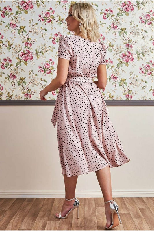 If you are looking for a cute little summer dress that is simple and stylish at the same time, then this polka dot tea dress with a collar from Goddiva is the one you want. The feminine cut accentuates your curves, while the short sleeves keep you cool on hot summer days! This classic polka dot day dress with a large collar is the perfect outfit for any summer day, from a picnic to that garden party you've been wanting to attend. This Tea Dress is designed with a high neckline, short sleeves and a fitted bodice, cinched at the waist with an eye-catching beige polka dots pattern. A style that will never not be fashionable and is an absolute essential to your summer wardrobe. This stunner of a short spring/summer dress is not only perfect for the obvious occasions, but is also a winner for date nights and of course the first thing you need to pack for your beach getaways. Team with sandals or wedges and let the dress do the talking.