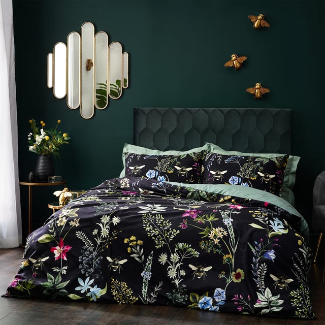 A striking digitally printed duvet set featuring an eye-catching contrast design, which will brighten up your bedroom in an instant, Busy bees hover among the bright, fresh florals of a meadow or garden, which are set on a contrasting luxuriously soft velvet jet black background. This exquisite set adds lovely pops of colour to your bedroom and gives it a natural feel too, helping you wake up in the morning and feel refreshed.