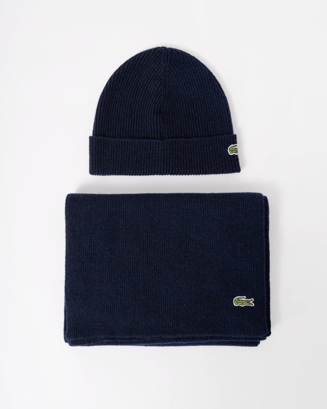 Lacoste knitwear is the result of 90 years of expertise. This scarf and beanie set is a great example. The ribbed knit creates a warm, soft feel with a timeless style.Essential pieces for modern life.

Recycled wool blend, limiting the need for raw materials
Scarf size: L71 x W12” / L180 x W30cm
Branded box
Crocodile on lower left of scarf
Crocodile on lower right of beanie
Wool (68%), Polyamide (26%), Acr (3%), Cotton (1%), Polyester (1%), Rayon (1%)

 