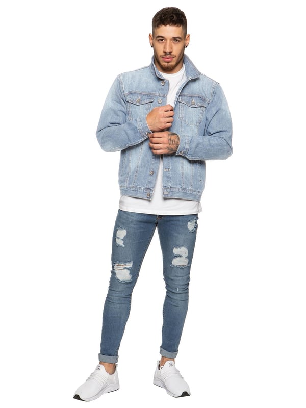 Your favourite wardrobe staple is right on trend this season; this casual Enzo jacket is tailored in washed blue denim for a rebellious look. With designer fashion details like the two chest pockets with buttoned flaps, a shirt style collar and a row of branded metal buttons, this casual layering piece can be worn all year round: wear with a T-shirt for a classic summer look or add a knit for cold weather fashion.