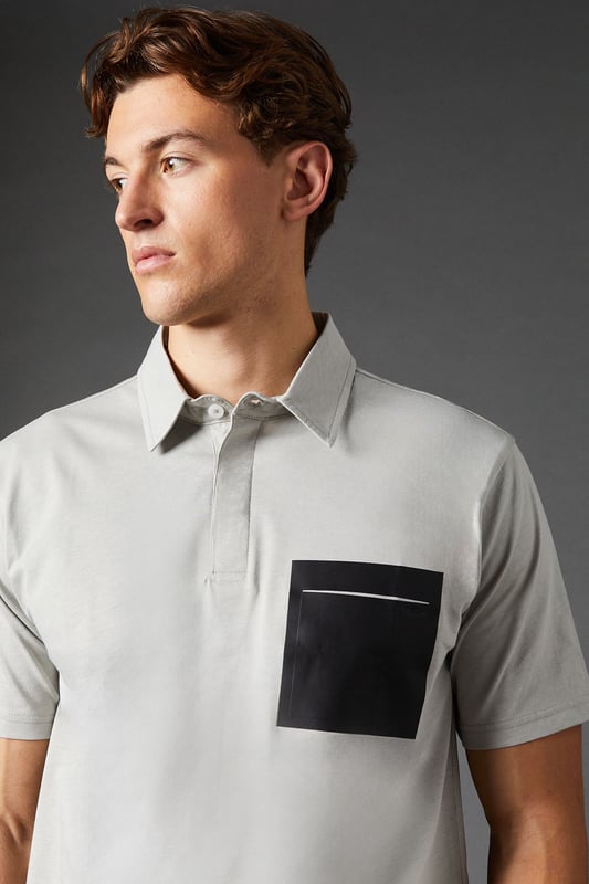 Classic polo silhouette with a modern twist
        Contrasting chest pocket adds visual interest
        Mercerised fabric for a subtle sheen and durability
        Short sleeves and collar for a smart-casual look
        Part of the exclusive Burton 1904 collection
    
    This 1904 Contrast Pocket Mercerised Polo from Burton seamlessly blends timeless style with contemporary details. Perfect for the discerning gent who appreciates subtle sophistication, this polo shirt is a versatile addition to any wardrobe. The contrasting chest pocket adds a touch of intrigue to the classic design, while the mercerised fabric ensures a luxurious feel and enhanced longevity. Ideal for casual outings or relaxed weekends, pair it with dark wash jeans and trainers for a pub lunch with mates. For a smarter look, team it with chinos and loafers for family gatherings or casual Fridays at the office. The polo's adaptable nature makes it a go-to choice for various occasions, from watching sports at home to impromptu garden parties. Embrace the effortless style of Burton's 1904 collection and make this polo a staple in your everyday rotation.