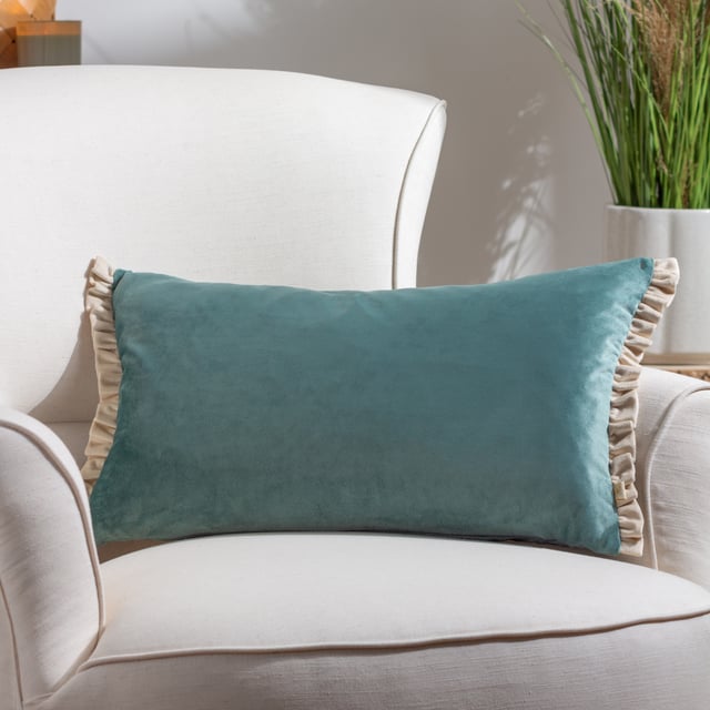 The Tilly cushion is made entirely of soft, opulent velvet and comes in a variety of soft pastel colours to help create a sophisticated look for your sofa. The dual-sided cottage core frill trim adds gravitas to the design, making it easy to combine with other larger cushions as part of a larger design scheme.