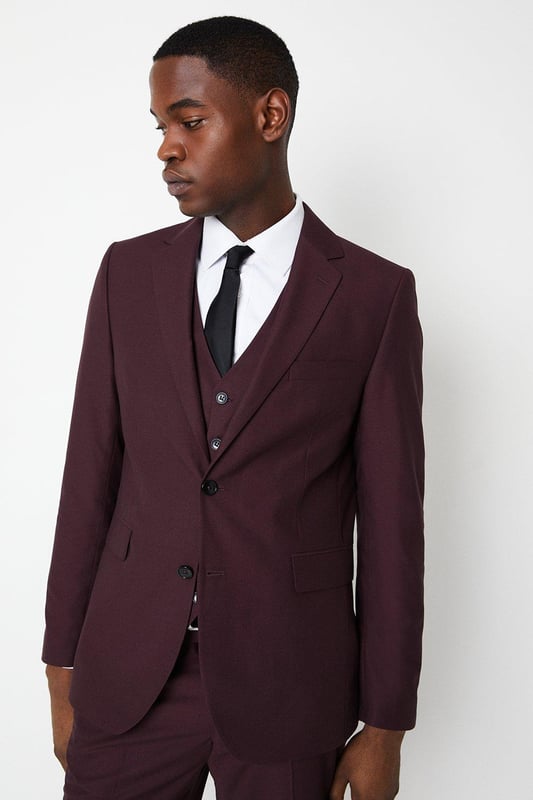 Slim, tailored fit for a sharp, modern silhouette
Two-button, single-breasted jacket with notched lapels
Sleek, streamlined design with minimal detailing
Premium, lightweight fabric with a hint of stretch
Versatile burgundy hue suitable for smart occasions

Exuding refined sophistication, this slim fit suit jacket from Burton is the epitome of contemporary tailoring. The sleek, streamlined silhouette hugs the body for a sharp, modern look that's perfect for smart casual events or formal occasions. Pair with tailored trousers and a crisp shirt for a polished ensemble that radiates confidence and style. The premium, lightweight fabric with a touch of stretch ensures a comfortable yet impeccable fit, allowing for ease of movement. Whether attending a wedding, business meeting, or evening soiree, this versatile jacket will have you looking dapper and on-trend.