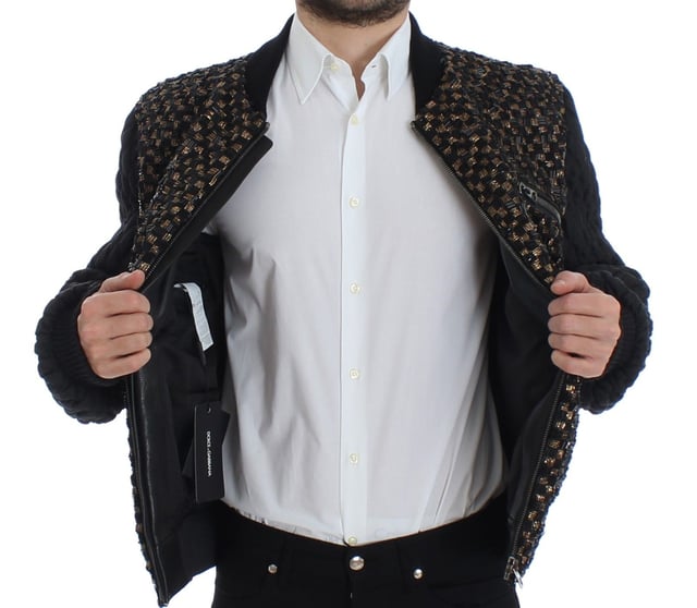 100% authentic Dolce & Gabbana black sequined jacket with gold detailing
  Straight from the Runway/catwalk
  Full zipper closure
  Four front pockets with zipper closure
  Two inside pockets
  Gold and black colored sequined detailing
  Quilted stitched arms
  Warm inner lining
  Logo details and logo engraved metal detailing
  Made in Italy
  Material: 35% Goatskin Leather 30% Lana wool 20% Glass 10% Plastic 5% Wool
  Lining: 42% Rayon 42% Acetate 16% Goatskin
Material: 35% Goatskin Leather 30% Lana wool 20% Glass 10% Plastic 5% Wool