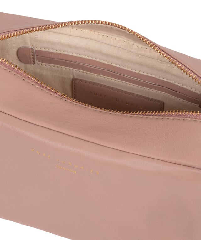 The 'Highgate' leather cosmetic bag is crafted from a luxurious smooth grain natural leather for a soft-touch and stylish finish. Features a zip-over top that conceals the central compartment lined with natural, untreated 100% cotton and has two internal slip pockets. Additional storage space is provided by a zipped pocket on the front of the bag. Finished with the iconic Pure Luxuries gold foil embossed logo and presented in a 100% cotton branded Pure Luxuries pouch.