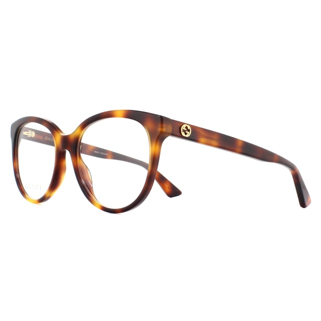 Gucci Glasses Frames GG0329O 002 Light Havana Women are an oversized round style with upswept corners for a subtle cat eye finish. The thick acetate frame is embellished with interlocking GG logos on the temples.