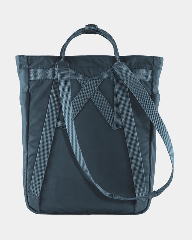 Fjallraven Kanken Unisex Totepack Unisex Kånken Totepack
Kånken Totepack is a convertible version of Fjällräven’s iconic backpack and can be either a backpack when you bike or a shoulder bag when you board a crowded bus. It has a zippered main compartment and an inside pocket with a padded base for a 13” laptop. With the seat pad you’ll find in the back of the main compartment, you can always take a break, wherever you are.
Made from durable, water-resistant G-1000 HeavyDuty S.
Top-loaded main compartment with zipper.
Inside laptop sleeve with padded base (up to 13 inches).
Zippered front pocket and open side pockets.
G-1000® HeavyDuty S: 65% polyester (recycled), 35% cotton (organic)
Organic cotton, Recycled polyester, Produced without PFCs
Inside compartment, Open outside pocket(s), Zippered outside pocket(s)
Adaptable with Greenland Wax, Durable, Quick-drying, Water resistant, Wind resistant
Clean with soft brush and lukewarm water
F23710