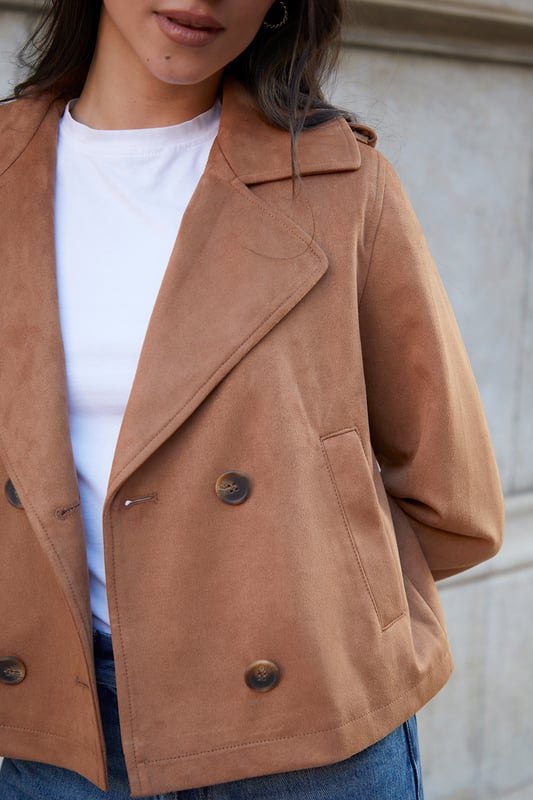 Get this coveted cropped suedette trench coat from Threadbare, a staple to complete your year-round outerwear collection. The classic trench comes in a short length and is made from a faux suede fabric. With a revere collar and double-breasted mock horn button fastening, this effortless throw-on trench coat has raglan sleeves with epaulettes for a tailored feel, and it's finished with button cuff straps and two front pockets for your essentials. Model wears UK size 8.