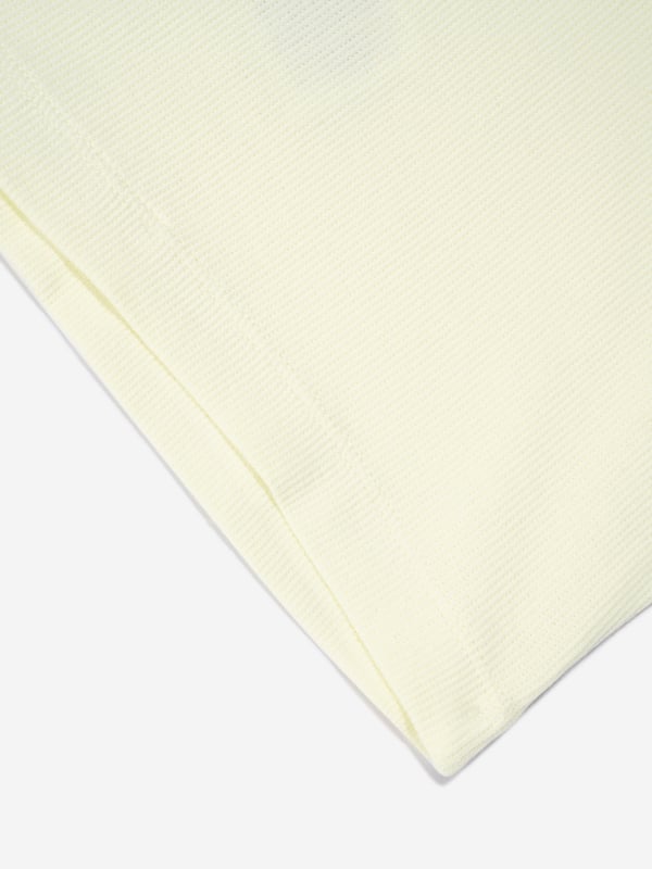 A cute and functional design, this girls Ranja top in yellow is a piece she will want to wear repeatedly. Depicted by Danish brand Molo, it features cut out ruffle sleeves and a scoop neck. Stylish and practical, she will look effortlessly fabulous.  Ruffle Design  Sustainable Scoop Neck