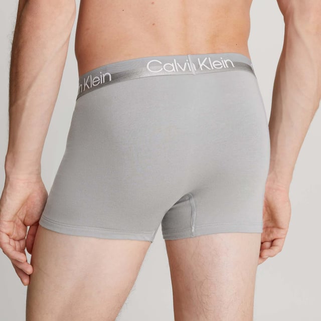 Mens Calvin Klein 3 Pack Trunks in blue.- Branded elasticated waistband.- Cotton stretch fabric.- Low rise.- Classic fit.- 95% Cotton  5% Elastane.- Ref: 000NB2970AMCAWaist: - S = 28-30in- M = 32-34in- L = 36-38in- XL = 40- 42in