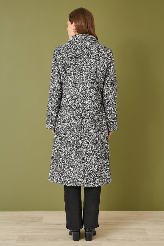 Amazing outerwear will see you through the season in style. This long line over coat is perfect for everyday wear. In a gorgeous boucle fabric that is both style and cosy, the simple and elegant design is a classic. With a collared neckline and deep front pockets.