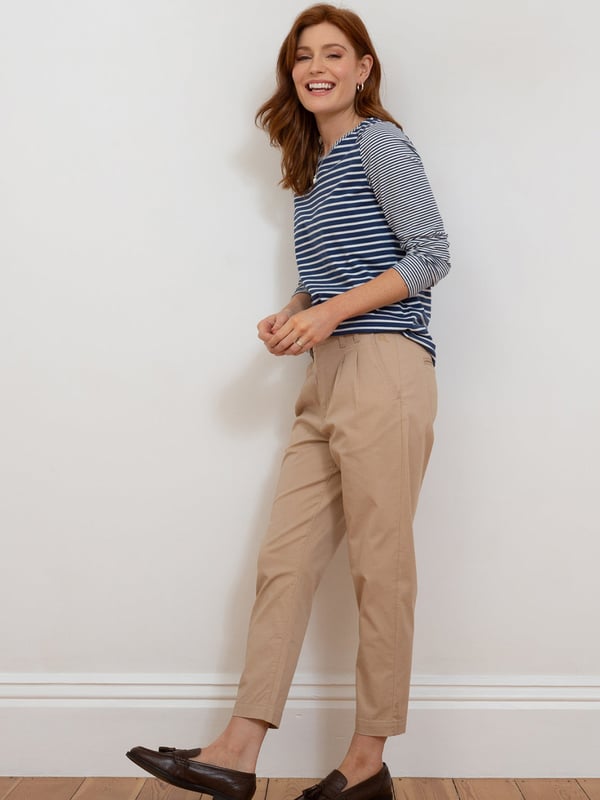 98% organic cotton 2% elastane | Beige | Twill fabric with a little bit of stretch | Apple enzyme washed for a soft hand feel | Zip and coconut button opening | Functional belt loops | Side pockets and back welt pockets | Cropped slim leg | Front pleating detail for a flattering fit | Made in Turkey | Machine washable at 40 degrees, or at 30 degrees to be kinder to the planet