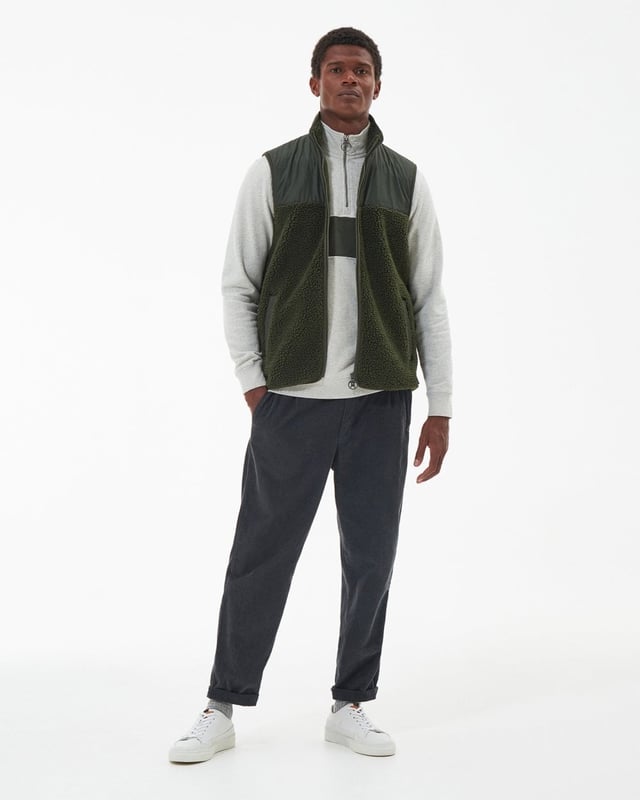 Barbour Newlan Fleece Gilet
A layering essential for the cooler months of the year, the Barbour Newlan Fleece Gilet is made from soft faux fur for a cosy look and feel. Boasting contrast panelling to the upper yoke and collar, it comes with lower welt pockets and tonal lycra binding to keep out the chill.

Barbour embroidery to left pocket
Main fabric (faux fur): 100% polyester
Secondary fabric: 100% polyester
Filling: 100% polyester
Machine wash 30?C
Back length: 70.5cm - 76.5cm

MFL0171