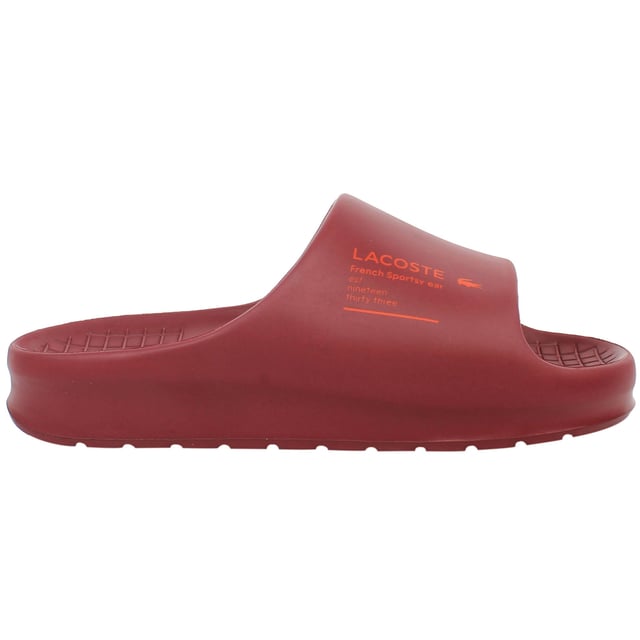 The Lacoste Serve Slide 2.0 223 2 CMA Men's Red Sliders deliver bold style and everyday comfort, making them an essential choice for casual wear, poolside relaxation, or beach outings. With their vibrant design and premium construction, these sliders offer practicality and flair.
Â 
Key Features:
Ergonomic Footbed: 

Contoured for superior comfort and support, providing a comfortable fit for extended wear.


Durable Synthetic Strap: 

Features the iconic Lacoste crocodile logo embossed for a sporty and stylish look.


Slip-On Design: 

Ensures easy on-and-off wear, making them perfect for leisure and quick outings.


Textured Rubber Outsole: 

Offers reliable grip and traction on various surfaces, even in wet conditions.


Lightweight Construction: 

Reduces fatigue, ensuring comfort for all-day use.


Water-Resistant Materials:

Designed to withstand exposure to water, making them ideal for pool or beach environments.


Bold Red Colorway: 

A striking and energetic design that adds a vibrant touch to your casual wardrobe.


Â 
The Lacoste Serve Slide 2.0 223 2 CMA Men's Red Sliders combine comfort, durability, and a bold aesthetic, making them a go-to option for relaxed and stylish footwear. Perfect for vacations, lounging, or adding a pop of color to your everyday look.
Â 
Â 
Â 