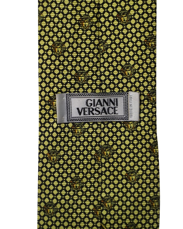 VINTAGE, RRP AS NEW
This Gianni Versace tie is a perfect formal accessory that has a sharp and modern appeal. Made from luxurious materials, it features intricate patterns, and the brand label is neatly stitched at the back. It is sure to add oodles of style to your blazers.

Gianni Versace Printed Tie in Yellow and Black Silk 
Condition: Excellent
Sign of wear: No
Color: Black and yellow
Material: Silk
Measurement: L 1480 x H 80mm 
SKU: 168964
