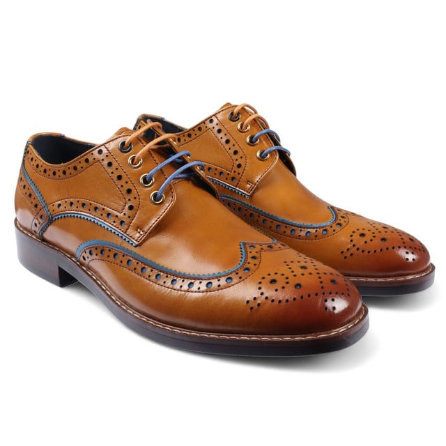 Elevate your formal style with the Justin Reess Simon Men's Brown Brogue Leather Shoes. These classic brogues feature decorative perforations and intricate detailing along the upper, adding a refined touch to any outfit. Made from premium leather, they offer durability and comfort for all-day wear. The lace-up closure ensures a secure, customizable fit, perfect for business meetings, weddings, and other formal occasions. These versatile shoes are a must-have addition to your wardrobe, seamlessly complementing any formal ensemble.

Classic Brogue Design with decorative perforations
High-Quality Leather Construction for durability and style
Lace-Up Closure for a secure, adjustable fit
Versatile Formal Wear suitable for various occasions