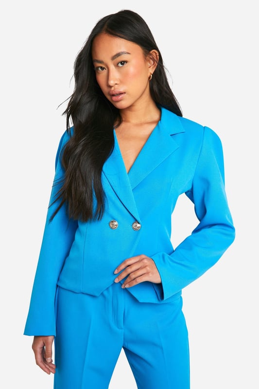 Structured woven crepe fabric for a polished look
        Slim fit design accentuates the silhouette
        Notched lapel collar adds a classic touch
        Double-breasted front with statement buttons
        Long sleeves for versatile styling options
    
    Make a bold statement with this eye-catching structured blazer from Boohoo. Perfect for the fashion-forward woman who loves to stand out, this piece combines sleek design with vibrant flair. The slim fit hugs your curves in all the right places, while the woven crepe fabric offers a luxurious texture that's sure to turn heads. Whether you're heading for a night out or looking to add some pizzazz to your office attire, this blazer has got you covered. Style it with the matching wide-leg trousers and strappy heels for a show-stopping ensemble that's ready for any social occasion. For a more casual look, pair it with your favourite jeans and trainers. The versatility of this blazer makes it a must-have addition to your wardrobe, perfect for those who love to mix and match their style.