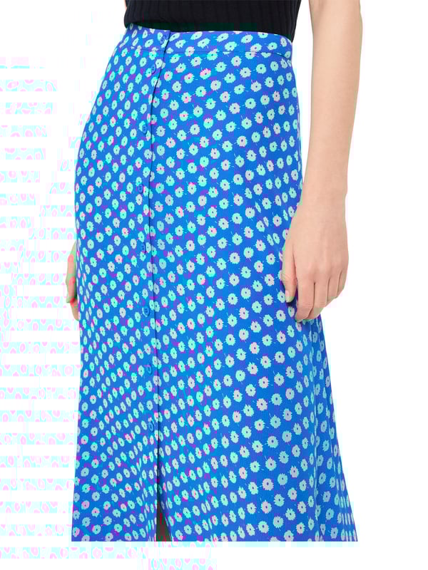Step out in playful style with this charming blue midi skirt adorned with a delightful polka dot floral pattern. Crafted from eco-friendly viscose, this piece is perfect for everyday elegance.