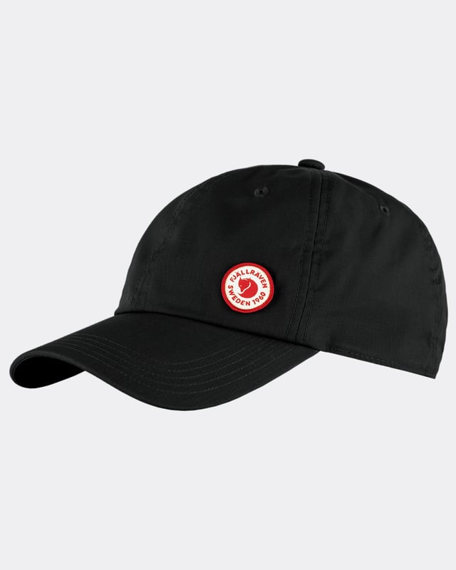 Fjällräven Logo Cap
When the sun is beating down, this cap will provide you with welcome shade and help you keep your cool. Made from G-1000 Lite in recycled polyester and organic cotton, it is lightweight and breathable in hot weather. Plain and simple with a small 1960 logo on the left front – the year that Fjällräven was founded. 

Comfortable cap in light and airy G-1000 Lite.
Made from recycled polyester and organic cotton.
Lightweight and breathable with embroidered ventilation holes.
Adjustable with a metal clasp at the back.
1960 logo on the left front.
Durable
hand wash
do not dry clean
do not tumble dry
do not bleach
do not iron
wash separately
G-1000® Lite: 65% polyester (recycled), 35% cotton (organic)

F13100181