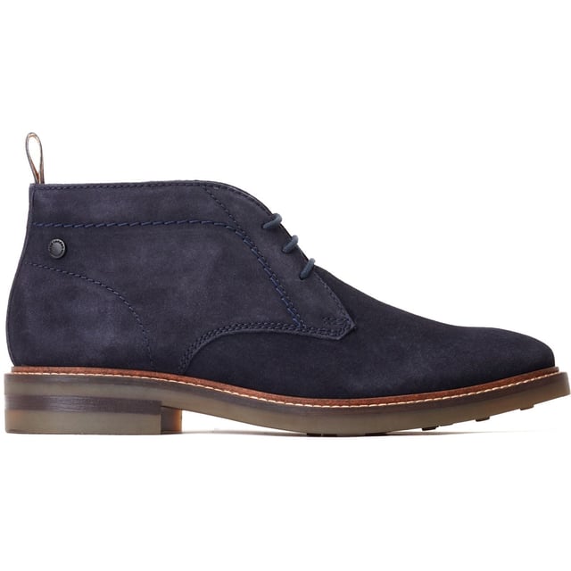 Stride in style with the Knebworth Men's Chukka Boot by Base London. Boasting premium leather uppers, a laid-back 3-lace closure, and a robust nylon pull tab for easy on/off, this Chukka boot features an Orthorlite insole for added comfort.