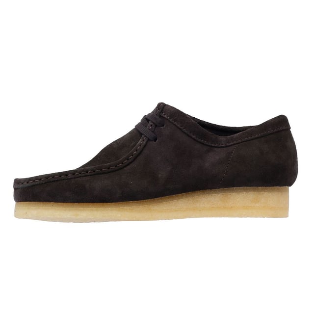 The iconic Clarks Wallabee shoe in boot style. The moccasin-inspired, structured silhouette offers clean and simple lines. Crafted from suede, the Wallabee boots features a lace up fastening and distinctive crepe sole.