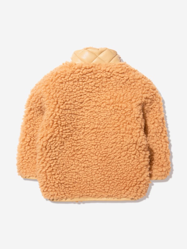 This sweet faux fur mini jacket from Stand Studio is perfect for little girls. Crafted from 100% polyester, it features a beige color and luxuriously soft fur. The cute design includes a snap front closure and side pockets for ultimate comfort and style. Perfect for a casual outing, it will keep little ones warm and looking cool.·  Stand Studio·  Occasion: Casual·  Plain