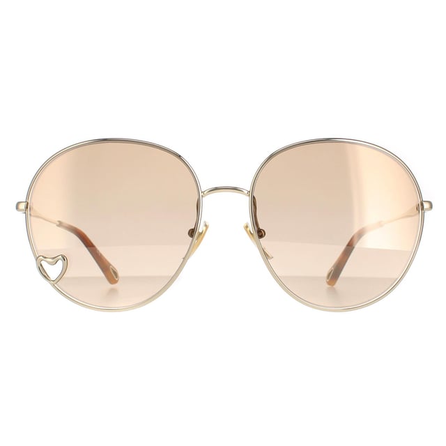 Las gafas de sol Chloe Round Womens Gold Brown Light Gold Mirror Ch0027S son un bonito estilo redondo fabricado en metal ligero. Las plaquetas nasales de silicona garantizan la comodidad durante todo el día, mientras que el logotipo de Chloe en el interior de las patillas -tips de autenticidad.