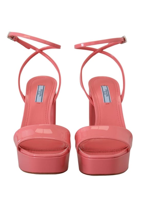 Brand: PRADA
  Condition: Brand new with tags
  Model: Block heels platform sandals
  Color: Pink
  Material: 100% patent leather
  Leather bottom sole for durability
  Logo details showcasing the iconic PRADA brand
  Made in Italy with high craftsmanship
  Exclusive and luxurious design
  Perfect for fashion-forward women
Material: 100% patent leather