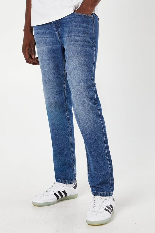 Slim fit design for a modern, tailored silhouette
        Classic five-pocket styling for practicality
        Mid-wash denim offers versatile styling options
        Subtle whiskering and fading for a lived-in look
        Belt loops for optional accessorising
    
    These Maine slim fit jeans are a wardrobe essential, perfect for the modern gent who values both style and comfort. The mid-wash denim provides a versatile canvas for countless outfit combinations, suitable for casual outings or relaxed work environments. Pair them with a crisp white tee and trainers for an effortlessly cool weekend look, or dress them up with a button-down shirt and loafers for smart-casual occasions. The slim fit flatters the silhouette without compromising on comfort, making these jeans ideal for long days out and about. Whether you're meeting friends for a pub lunch or attending a family gathering, these jeans will keep you looking sharp and feeling at ease. Their durability and timeless design ensure they'll remain a go-to choice in your wardrobe for seasons to come.
