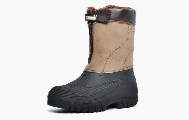 The Venture all-weather boot by Cotswold is the perfect choice if youre looking for a stylish, reliable boot to keep you dry and warm in the colder seasons ahead.
 A front zip and hook and loop fastening locks the foot in place, boasting easy on / off wear, while the luxurious fur lining gives a warmth and comfort feeling. Crafted from a durable rubber, the outsole of these boots delivers excellent traction on any surface you throw at it so youre comfortable in knowing this great value boot has you covered wherever you go.
 The Venture is delivered in a robust design with a luxury faux suede fabric upper and a fully waterproof moulded rubber galosh lower foot to combat the harsh wet and wintery elements.
  Faux Suede Fabric Upper
  Waterproof rubber galosh
  Thick textile fleece lining
  Durable rubber outsole providing excellent traction.
  Easy on / off wear with the use of front zip and hook and loop strap
  Hybrid boot for all seasons
  Cotswold branding
 Please note -this boot is only waterproof in the rubber galosh area and not in the Faux suede shaft of the boot so walking through very long wet grass or deeper water will render these boots not waterproof.
 * Please note these boots come polybagged and are not boxed *