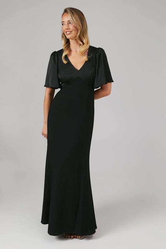 Elegant V-neckline for a flattering silhouette
        Graceful angel sleeves add a touch of romance
        Striking open back design with tie detail
        Floor-length skirt for a sophisticated look
        Luxurious satin fabric for a polished finish
    
    This stunning bridesmaids dress from Coast is the epitome of elegance and grace. Perfect for your role in the bridal party, this gown combines classic sophistication with modern details. The V-neckline and angel sleeves create a romantic silhouette, while the open back with tie detail adds a contemporary twist. The floor-length skirt ensures a refined look as you walk down the aisle. Crafted from sumptuous satin, this dress drapes beautifully and catches the light in all the right ways. Pair with delicate jewellery and strappy heels to complete your bridesmaid ensemble. Whether you're standing beside the bride or dancing the night away at the reception, this dress will ensure you look and feel fabulous throughout the wedding celebrations.