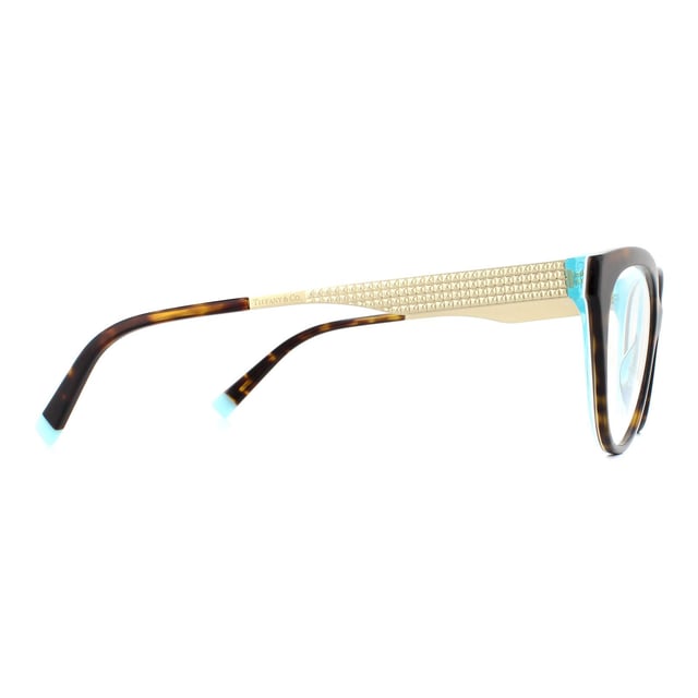 Tiffany Glasses Frames TF2180 8275 Havana Crystal Blue 54mm are a gorgeous butterfly design with an acetate front and temple tips and slender flat metal Diamond Point temples. Flashes of Tiffany blue at the temple tips provide brand recognition.