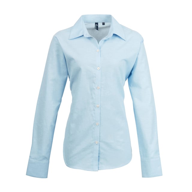 Ladies signature Oxford long sleeve Easycare blouse with wrinkle free finish for a smart and professional appearance. Soft collar styling. Rounded bottom hem. Fitted styling with bust and back darts. Pearlised buttons on light blue and white shirt, self c. Fabric:70% Cotton, 30% Polyester, cotton rich Oxford weave Weight: 135gsm. 8, 10, 12, 14, 16, 18, 20, 22, 24