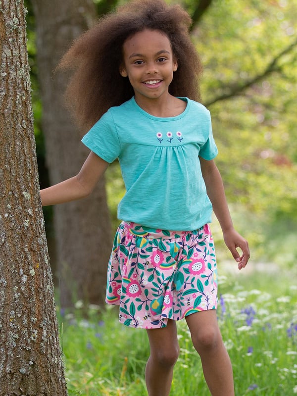 95% organic cotton 5% elastane | Proud to be certified to the Global Organic Textile Standard (GOTS) | Hello Earth all-over print | Single jersey with a little bit of stretch (180-190 gsm) | Skirt with matching built-in shorts | Elasticated waistband | Made in Turkey | Machine washable at 40 degrees, or at 30 degrees to be kinder to the planet