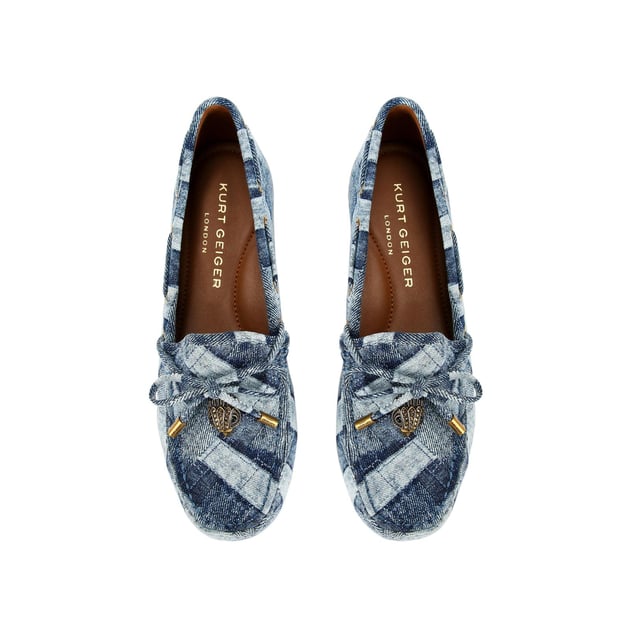 The Eagle Moccasin from Kurt Geiger is a slip on loafer. The upper is crafted from a denim with weave effect. There is a bow with antiqued brass eagle on each toe.