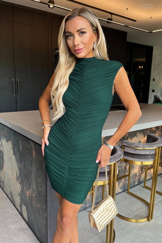 Our Teal High Neck Bodycon Ruched Mesh Mini Dress is perfect for
showing off your curves! Featuring a sleeveless high neck top, a
ruched bodycon silhouette and a zip up back.  Team it with strappy
heels and a clutch for your next nigh out.

Model wears: UK 8/ EU 36/ US 4
Model's height: 165cm/ 5'5"
Approx length from centre back to hem: 90 cm
Fabric composition:  95% Polyester 5% Elastane
Colour: TEAL
