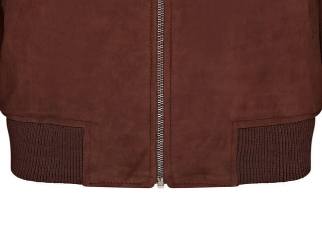 Introducing the Men's Varsity Suede Leather Bomber Jacket, a refined take on the classic MA-1 flight jacket. Crafted from 100% soft goat suede, this jacket offers exceptional durability and a supple drape. The exposed zip front features a wide, quilt stitch zip stand, complemented by a rib knit collar, cuffs, and hem for added warmth and a sleek silhouette. With four pockets�two at the waist and two inside, including a secure zipped pocket�this fully lined jacket combines style and functionality seamlessly.

� Made from 100% soft goat suede for durability and comfort
� Exposed zip front with quilt stitch zip stand
� Rib knit collar, cuffs, and hem for insulation
� Four pockets: two waist and two interior, one with a zip
� Fully lined interior for added warmth and comfort