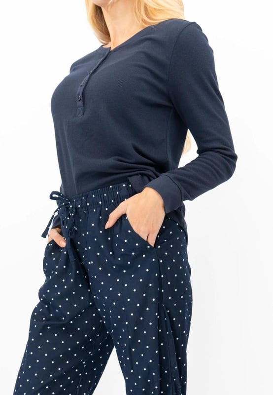 This cozy, cotton-blend Gap pajama set includes a long-sleeved knit thermal, with a rounded hem, a crew neckline, and a Henley-style button placket. - - .  The matching bottoms are wide-leg flannel pants in choice of spotted, finished with handy side pockets, an elastic waistband with adjustable drawcord. - - . Fabric Content: Bottoms: 100% Cotton| Top: 60% Cotton, 40% Poly. - . Packaged as a gift set - ideal Christmas present!