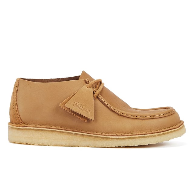 Introducing the Nomad shoe, a fusion of Wallabee and Desert Trek styles, boasting hand-stitched details. Crafted from premium mid tan leather upper for durability and style. Finished with a lightweight pebble crepe sole for added comfort and traction.