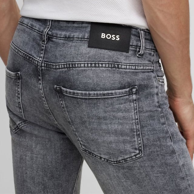 Mens BOSS Delaware3 Slim-Fit Jeans in charcoal.- Button and zip-fly fastening.- Five pocket design.- Branded leather patch.- Signature trims.- Slim fit.- Ref: 50496190016