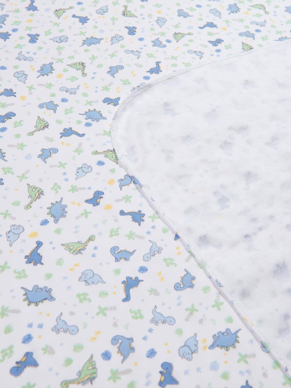 Presenting the esteemed Baby Boys Dinoland Swaddle Blanket in White from Magnolia Baby ‚ a luxurious addition to your little one's nursery. Key features include: Elegance and Finesse: The Dinoland print is trendy yet tastefully restrained, making it an exceptional piece for your baby boy's wardrobe. Plush Comfort: High-quality fabric ensures delicate coziness for your little one, ensuring a heavenly night's sleep. High-End Fashion: Crafted by Magnolia Baby, expect nothing but the best in terms of style and comfort.Revitalize your baby's collection with this exquisite swaddle blanket. Grab yours and embrace understated luxury.