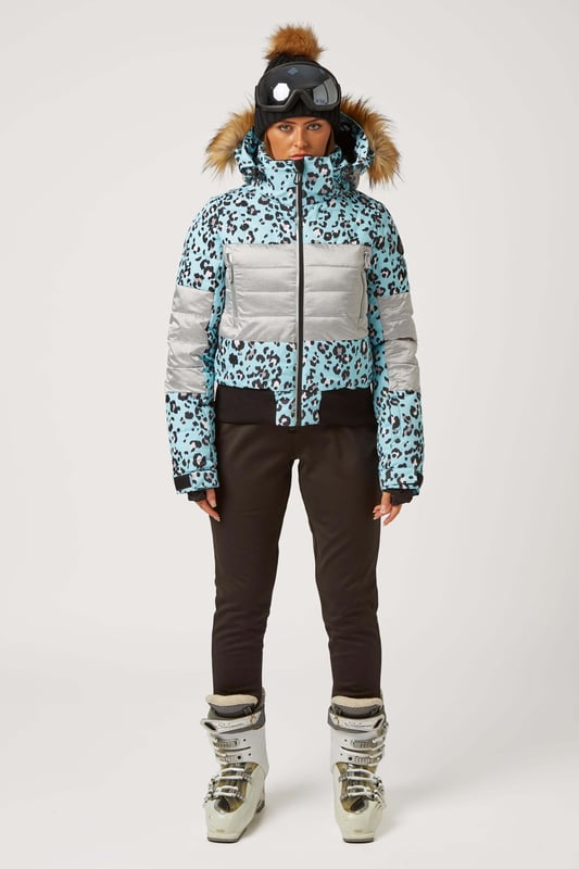 The Surfanic Fiore ski and snowboard jacket is a popular street-styled high-performance mountain jacket for all occasions. Classic feminine design with premium warmth, this low loft puffer jacket is filled with 100% recycled insulation that warms up as quickly as it dries out, for all-day comfort. This street-styled block gives you the right mix of form and function.

The Surftex 10K outer shell provides excellent waterproof protection from the winter elements, while the 10K breathability rating allows body heat and moisture to escape through the fabric for optimum comfort throughout the day. The jacket's shell fabric has a high-performance durable coating with taped seam construction that offers exceptional heat retention in cold conditions and a high level of breathability that ensures excess heat doesn't form into condensation on the inside of the jacket.

The detachable hood has a 3-way volume adjuster for increased all-round visibility when you are flying down the mountain and require the added protection of having your hood up and when the weather offers you a challenging day. The water-resistant front zipper has an internal reinforced storm flap for increased comfort and protection.

Powder skirt - Whether you're hitting the powder on skis or snowboard, this snow skirt creates a tight seal around your waist to keep the snow out and the warmth in. Made from durable waterproof materials and an internal dry butt patch (DBP) to keep it all warm and dry.

Snow cuff / wrist gaiter - This is perfect for even the most extreme conditions, featuring a tight seal that bridges the gap between your glove and jacket.

Zipped pockets - Pockets designed for everything plus a few more just in case. Pockets for goggles, lift pass, media, stash pocket for cash, wallet pocket and inside phone pocket for protection and to keep the battery warm and dry. Plus a detachable goggle wipe for those days when visibility is at a premium.

Design features:

    Detachable fur
    3-way volume adjusting hood
    Super soft chin guard
    Zipped sleeve ski pass pocket
    Snow cuffs with thumb loop
    Media pocket
    Goggle pocket
    Mesh-lined pit zips
    Detachable goggle wipe
    Twin zipped tricot lined hand warmer pockets
    Reinforced internal storm flap
    Waterproof snow skirt
    Dry butt patch (DBP)

Fabric & performance:

    Bomber fit
    Shell 100% polyester
    Water resistant coating 10,000mm
    Breathbility rating MVP 10,000 gm²

Insulation & lining:

    100% recycled polyester low loft insulation.
    Insulation. 80 gm² body 40 gm² Sleeves
    Lining 100% recycled embossed polyester.