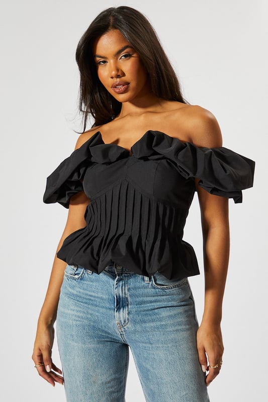 Striking bardot neckline with ruffle detail
        Cinched waist for a flattering silhouette
        Off-shoulder design with short sleeves
        Textured fabric with vertical pleating
        Cropped length perfect for high-waisted bottoms
    
    Make a statement with this eye-catching Ruffle Bardot Cinched Waist Top from MissPap. The off-shoulder design with its dramatic ruffle detail creates a captivating look that's sure to turn heads. The cinched waist accentuates your figure, while the vertical pleating adds texture and interest. Perfect for those who love to be the centre of attention, this top pairs beautifully with high-waisted jeans for a casual yet stylish ensemble. Dress it up with a sleek skirt and heels for a night out, or keep it relaxed with wide-leg trousers and trainers for a chic daytime look. Whether you're heading to a family gathering or meeting friends for drinks, this versatile piece allows you to customise your style to suit any casual occasion. The cropped length is ideal for showing off your favourite bottoms, making it a must-have addition to your wardrobe.