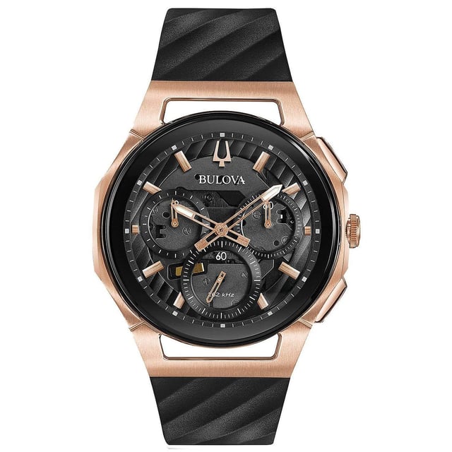 This Bulova Curv Chronograph Watch for Men is the perfect timepiece to wear or to gift. It's Rose Gold 41 mm Round case combined with the comfortable Black Rubber watch band will ensure you enjoy this stunning timepiece without any compromise. Operated by a high quality Quartz movement and water resistant to 3 bars, your watch will keep ticking. This classic chronograph watch gives a comfortable feeling with its leather strap, and its anti-reflective curved sapphire glass is perfect for every occasion -The watch has a function: Five-hand chronograph, Luminous Hand High quality 21 cm length, 20 mm wide Black Rubber strap with a Buckle Case diameter: 41 mm, Case height: 11 mm and Case color: Ip-rosé Dial color: Black