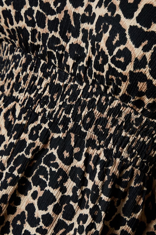 Animal Ruffle shoulder shirred waist long sleeve top